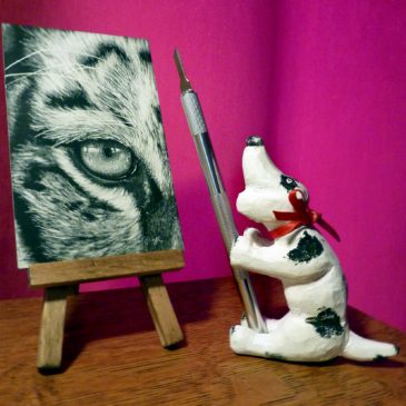 Wooden Dog next to Eye of the Tiger scratchboard © Judy Lavoie 2020