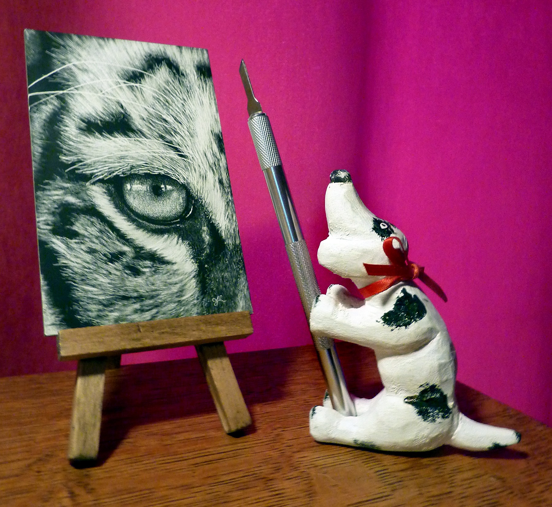 Wooden Dog next to Eye of the Tiger scratchboard © Judy Lavoie 2020