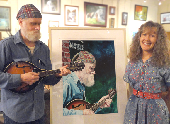 Judy with Jerry and her painting of him "Jerry Van, Music Man" at a solo show